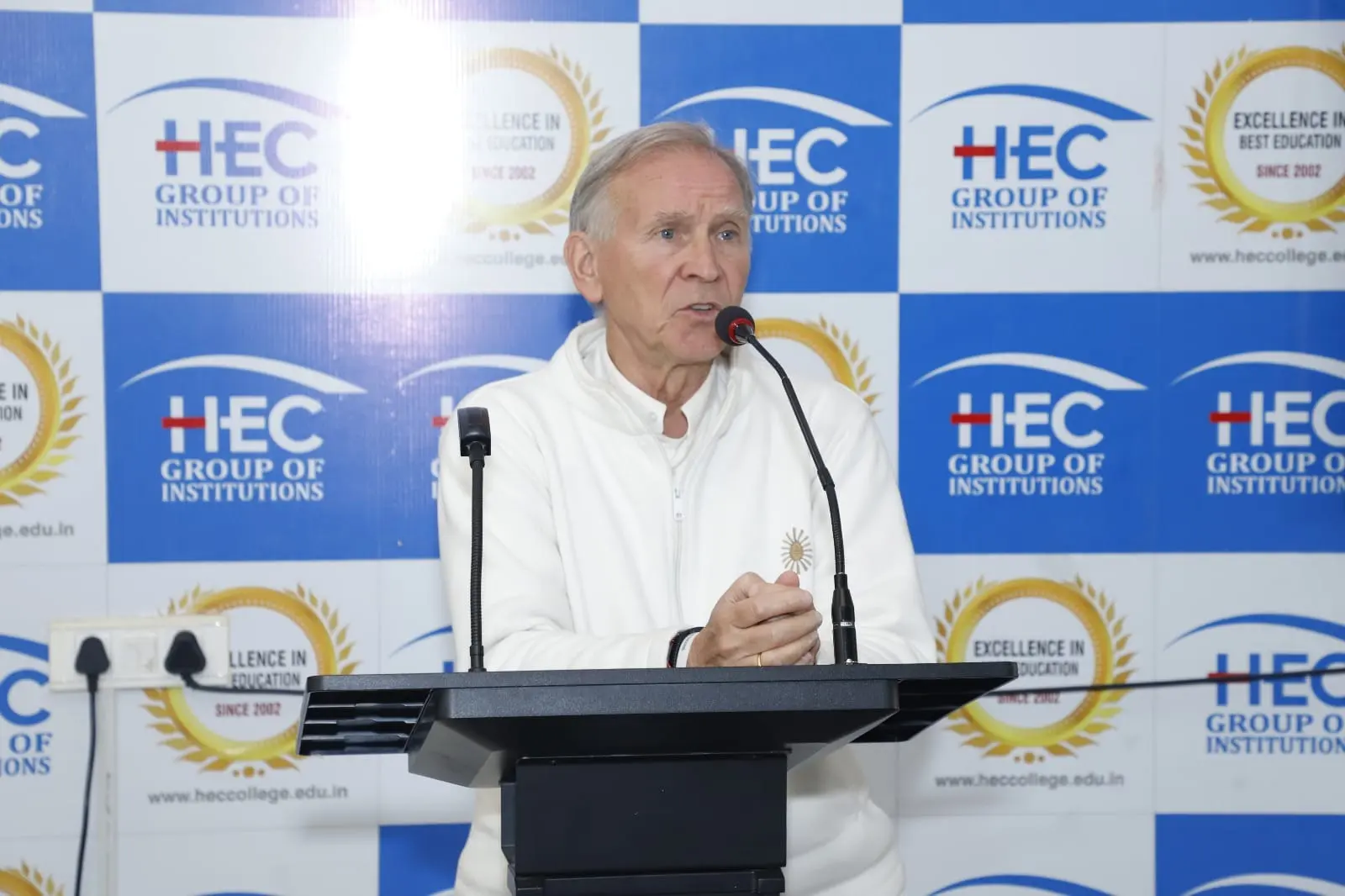 A guest speaker addressing students from the podium