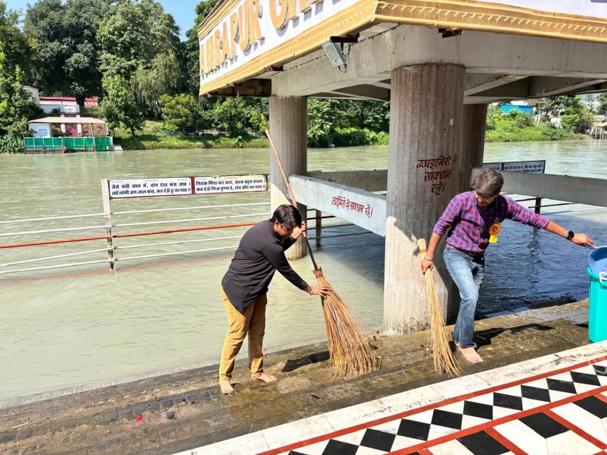 Students sweeping the river ghat during a cleanliness drive