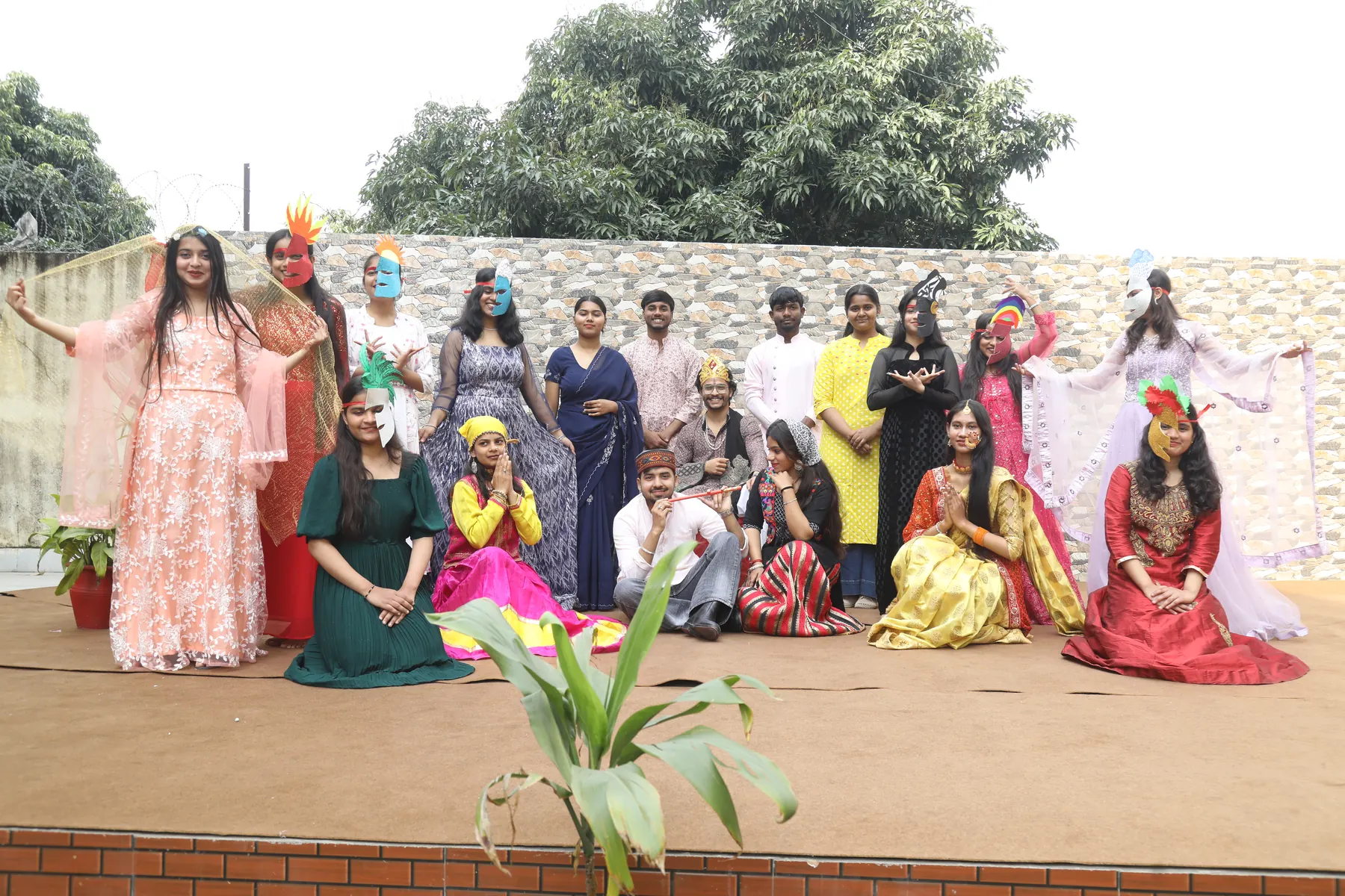 Students in colourful costumes after a cultural performance